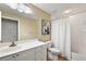 Clean bathroom with a tub, toilet and vanity at 5046 Harbour Dr, Oxford, FL 34484