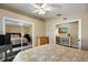 Bedroom with a queen-size bed, dresser, and mirrored closet doors at 5046 Harbour Dr, Oxford, FL 34484