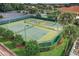 Aerial view of well-maintained tennis and pickleball courts at 5046 Harbour Dr, Oxford, FL 34484