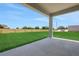 Covered patio offering serene views of the expansive backyard, blending indoor/outdoor living seamlessly at 5095 Firebush Dr, Apopka, FL 32712