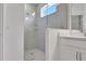 Modern bathroom featuring a sleek glass-enclosed shower and stylish vanity with sink, offering a luxurious feel at 5095 Firebush Dr, Apopka, FL 32712