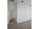 Bright bedroom with carpet floors and sliding door closet, with the door open leading to the rest of the home at 5095 Firebush Dr, Apopka, FL 32712