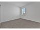 Bright bedroom featuring plush carpet and a large window at 5095 Firebush Dr, Apopka, FL 32712
