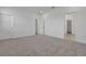 Spacious bedroom offers ample space with neutral carpet and a walk-in closet, creating a cozy retreat at 5095 Firebush Dr, Apopka, FL 32712