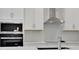 Close up of kitchen area featuring stainless steel appliances, granite countertops, and a tile backsplash at 5095 Firebush Dr, Apopka, FL 32712