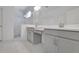 Modern bathroom featuring a glass-enclosed shower with marble tile and double vanity at 5131 Firebush Dr, Apopka, FL 32712