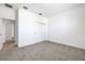 Spacious bedroom featuring neutral carpet, white walls, and a sliding-door closet at 5131 Firebush Dr, Apopka, FL 32712