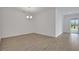 Dining room with a chandelier and a sliding glass door that leads to a patio at 5131 Firebush Dr, Apopka, FL 32712