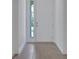 Inviting entryway with stylish tile flooring and a view of the front door, flooded with natural light at 5131 Firebush Dr, Apopka, FL 32712
