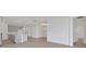 Open-concept living room features recessed lighting and wood-look tile flooring at 5131 Firebush Dr, Apopka, FL 32712