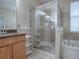 Bathroom with double sinks, shower and tub at 5929 Coquyt Dr, Mount Dora, FL 32757