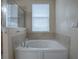 Relaxing bathroom with soaking tub and shower at 5929 Coquyt, Mount Dora, FL 32757