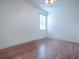 Bright bedroom featuring hardwood floors and ceiling fan at 5929 Coquyt Dr, Mount Dora, FL 32757