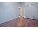 Spacious bedroom with hardwood floors and double door closet at 5929 Coquyt Dr, Mount Dora, FL 32757