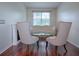 Sitting area with a white couch and two armchairs at 5929 Coquyt, Mount Dora, FL 32757