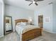 Main bedroom with a queen bed and ensuite bathroom at 6220 Topsail Rd, Lady Lake, FL 32159