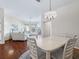 Dining area with hardwood floors and view of living room at 6220 Topsail Rd, Lady Lake, FL 32159