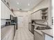 Modern kitchen featuring stainless steel appliances and ample cabinetry at 6220 Topsail Rd, Lady Lake, FL 32159