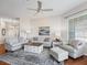 Comfortable living room with hardwood floors and neutral color palette at 6220 Topsail Rd, Lady Lake, FL 32159