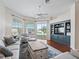 Relaxing living room featuring hardwood floors and built-in entertainment center at 6220 Topsail Rd, Lady Lake, FL 32159