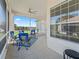 Relaxing screened porch with seating area and view of the backyard at 6220 Topsail Rd, Lady Lake, FL 32159