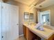 Bathroom with single sink vanity and toilet at 647 Calabria Ave, Davenport, FL 33897