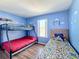 Toy Story themed bedroom with bunk beds and wood-look floors at 647 Calabria Ave, Davenport, FL 33897