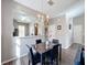 Dining area with a marble table and chandelier at 647 Calabria Ave, Davenport, FL 33897