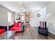 Living room with red couches and wood-look floors at 647 Calabria Ave, Davenport, FL 33897