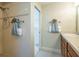 Clean bathroom with shower, double vanity, and updated fixtures at 670 Murphys Estate Dr, The Villages, FL 32162