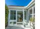 Exterior view of sunroom with access from patio at 670 Murphys Estate Dr, The Villages, FL 32162