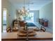 Kitchen with breakfast bar, view of living and dining area at 670 Murphys Estate Dr, The Villages, FL 32162