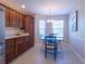 Kitchen nook with wood cabinets and a window seat at 670 Murphys Estate Dr, The Villages, FL 32162