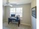 Home office with built-in desk, window, and ceiling fan at 670 Murphys Estate Dr, The Villages, FL 32162