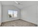 Bright bedroom with window, ceiling fan, and carpet at 6851 Wendy Way, The Villages, FL 34762