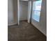 Bright bedroom featuring a closet and window with blinds at 6851 Wendy Way, The Villages, FL 32163