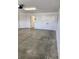 Large garage with concrete floor and extra storage at 6851 Wendy Way, The Villages, FL 32163