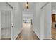 Spacious hallway with wood-look floors and light walls at 6851 Wendy Way, The Villages, FL 34762