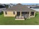 Rear view of house showing screened porch and deck at 6851 Wendy Way, The Villages, FL 34762