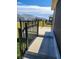 Concrete patio with black metal railings and steps down to yard at 6851 Wendy Way, The Villages, FL 32163