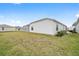 Fenced backyard with grassy area at 7189 Denver Ave, The Villages, FL 34762