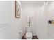 Simple bathroom with shower, toilet, and white vanity at 7189 Denver Ave, The Villages, FL 34762