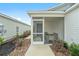 Screened porch with seating area, located off of the house at 7189 Denver Ave, The Villages, FL 34762