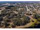 Aerial view of property showcasing large lot and lakefront access at 73 N Carol Ave, Mascotte, FL 34753