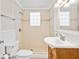 Clean bathroom with a shower, toilet and vanity at 73 N Carol Ave, Mascotte, FL 34753