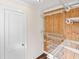 Walk-in closet with wire shelving and wood walls at 73 N Carol Ave, Mascotte, FL 34753