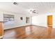 Bright living room with hardwood floors and wood ceiling at 73 N Carol Ave, Mascotte, FL 34753