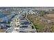 Aerial view of houses with solar panels, near a lake and conservation at 808 Brooklet Dr, Davenport, FL 33837