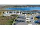 Aerial view of a house and surrounding neighborhood with a lake at 808 Brooklet Dr, Davenport, FL 33837