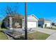 One-story home with gray siding, white garage door, and small front yard at 808 Brooklet Dr, Davenport, FL 33837